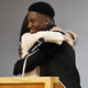 Meghan, Duchess of Sussex embraces student Aker Okoye during a special school assembly at the Robert Clack Upper School in Dagenham ahead of International Women’s Day (IWD) held on Sunday 8th March, on March 6, 2020, in London, England.